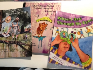 A photo of three books illustrated by watercolor artist Jo Myers-Walker
